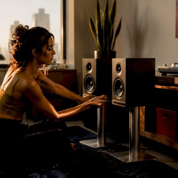 Cozy bedroom audio setup with powered speakers