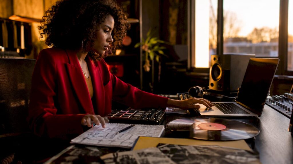 Female producer creating concept album interlude