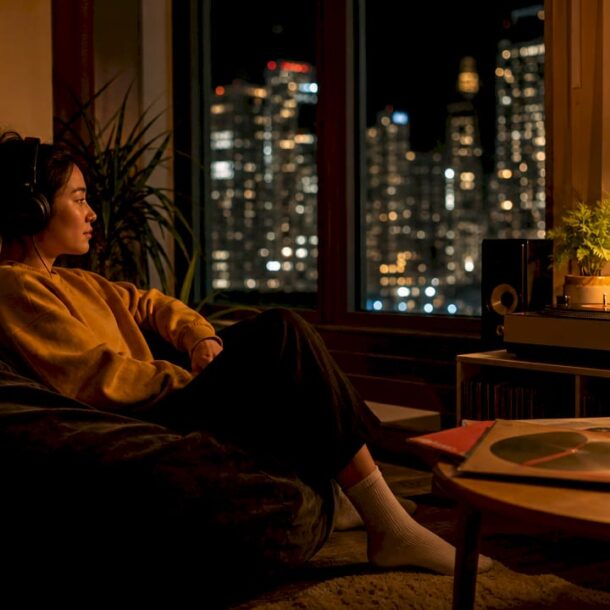 Woman listening to music at night with headphones