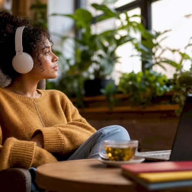Woman with headphones in cozy workspace