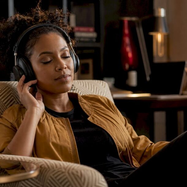 Woman listening deeply with headphones indoors