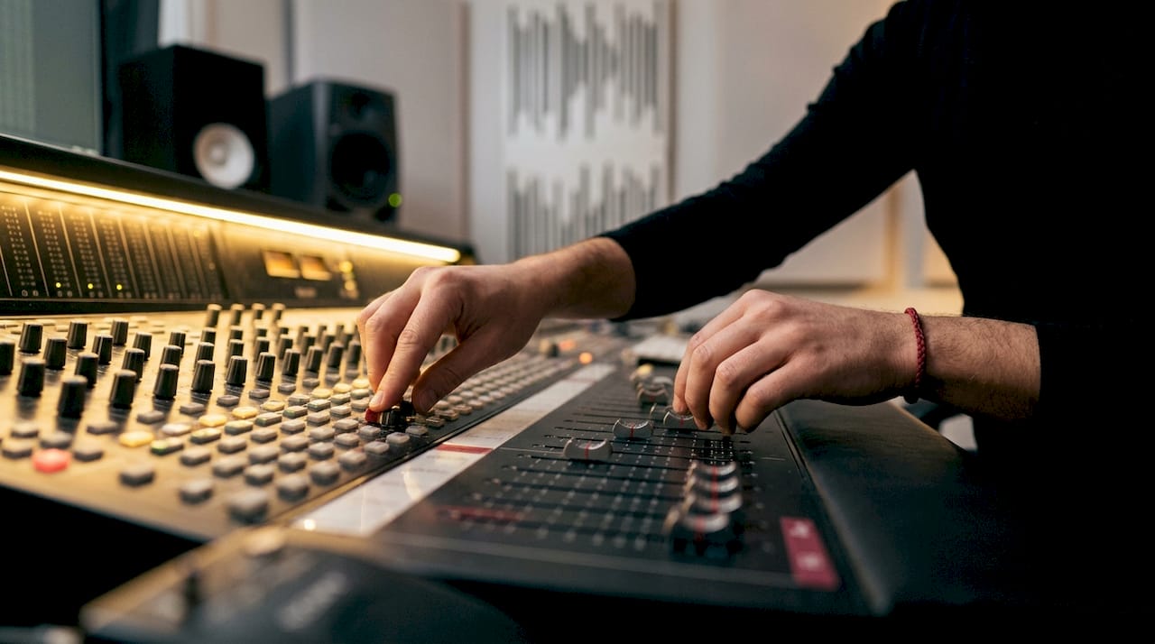 Close-up of hands mixing ambient music tracks