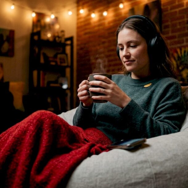 Woman listening to love songs at night with headphones