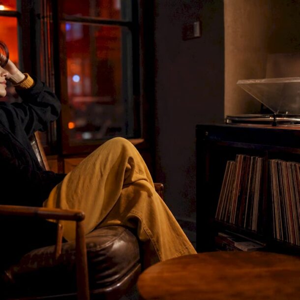 Woman listening to cinematic music at night